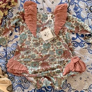 Kate Quinn Size 6-12m ruffle romper/one piece